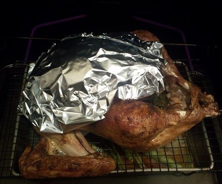 Cover roasting turkey with foil