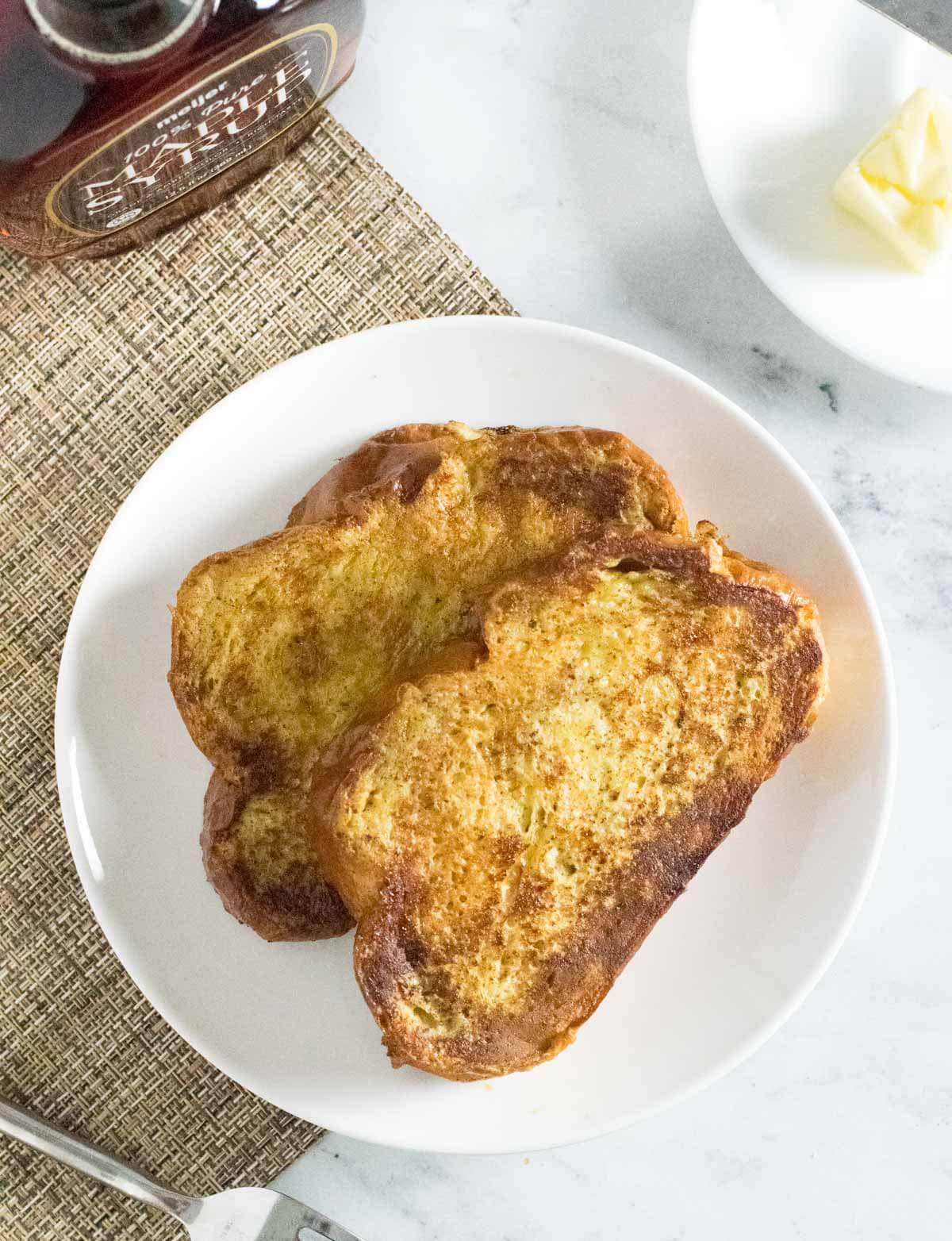 Two slices of French toast served on a plate.