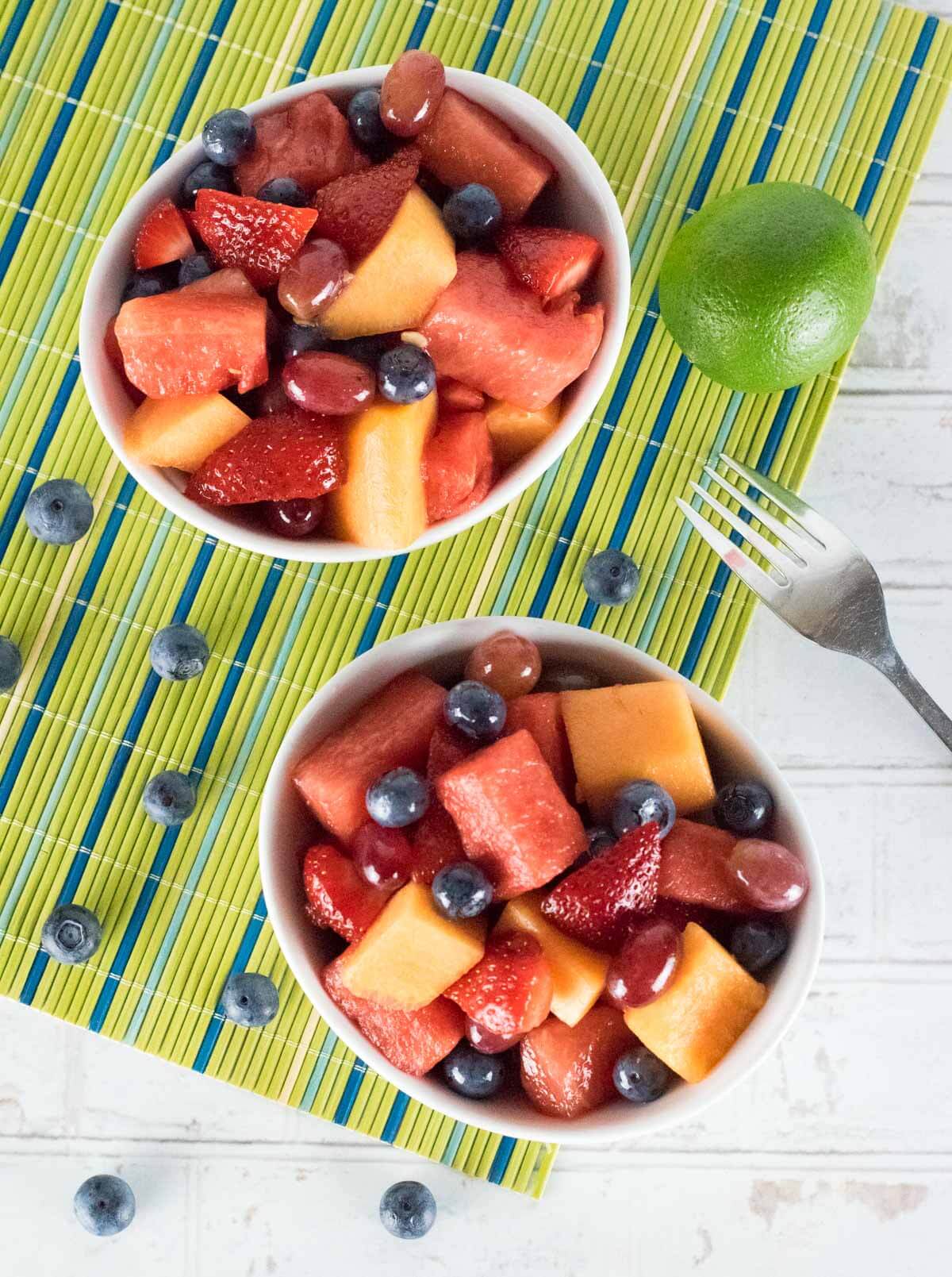 Showing the best fruit for fruit salad  - watermelon, blueberries, strawberries, melons, and grapes.