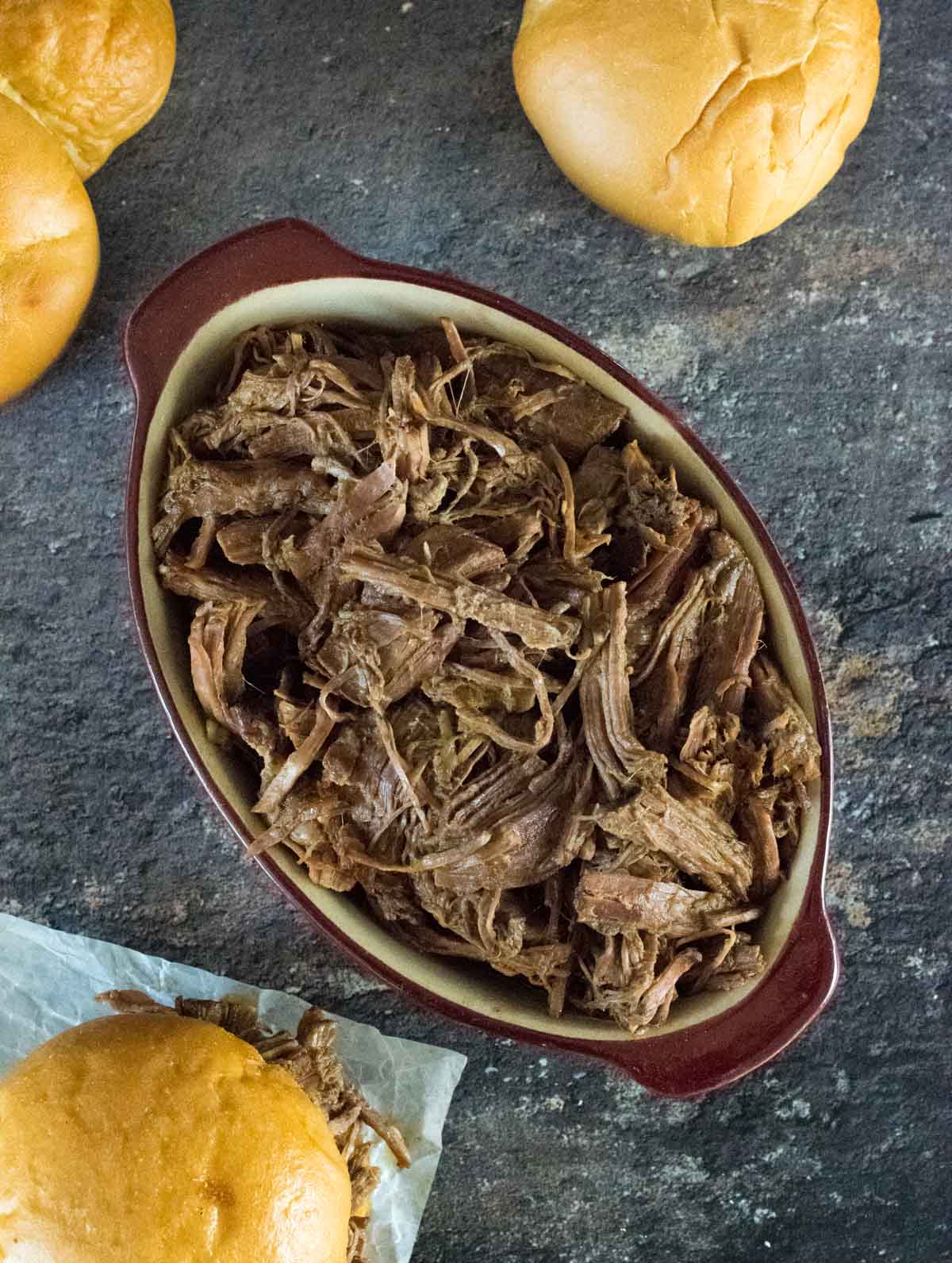 Crockpot shredded beef in a serving pan.