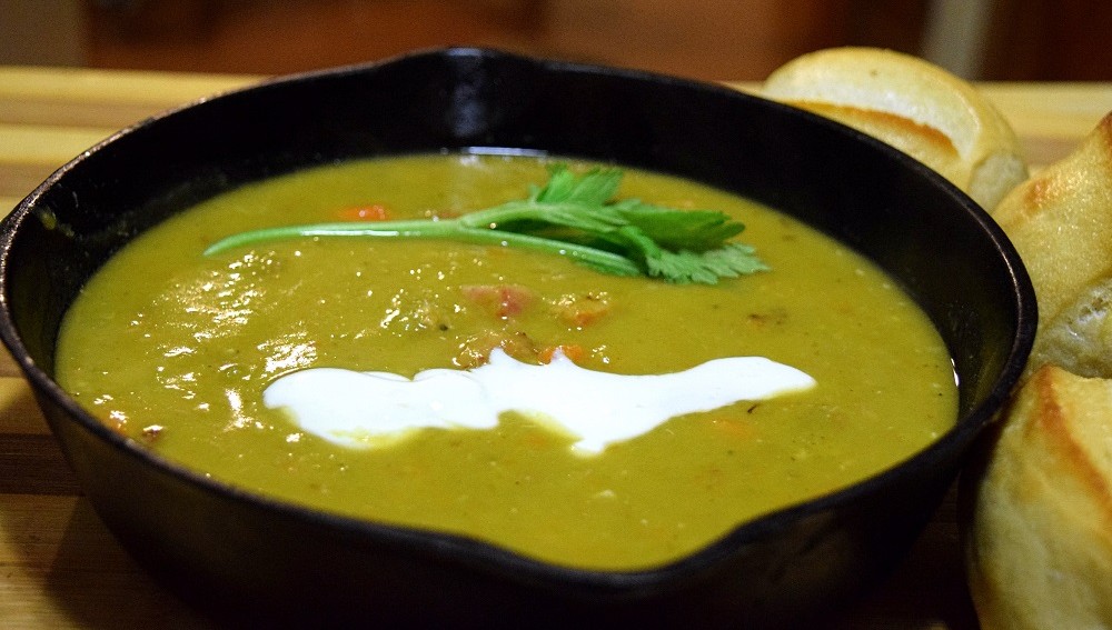 Homemade split pea soup in cast iron pan 