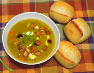 Homemade Split pea soup recipe with ham and bread rolls