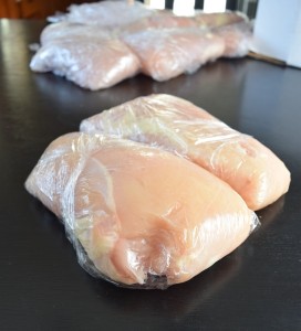 Wrap plastic around meat to help freeze it