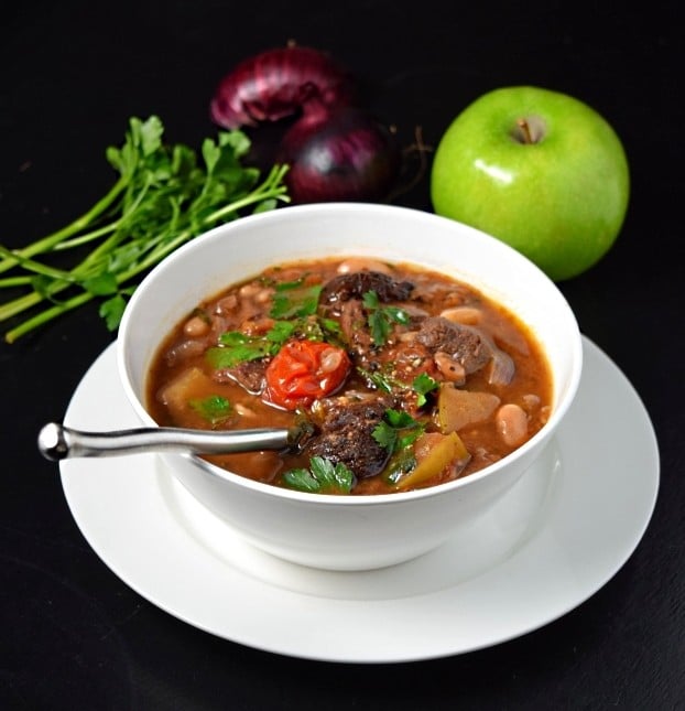 Hearty venison stew recipe in white bowl