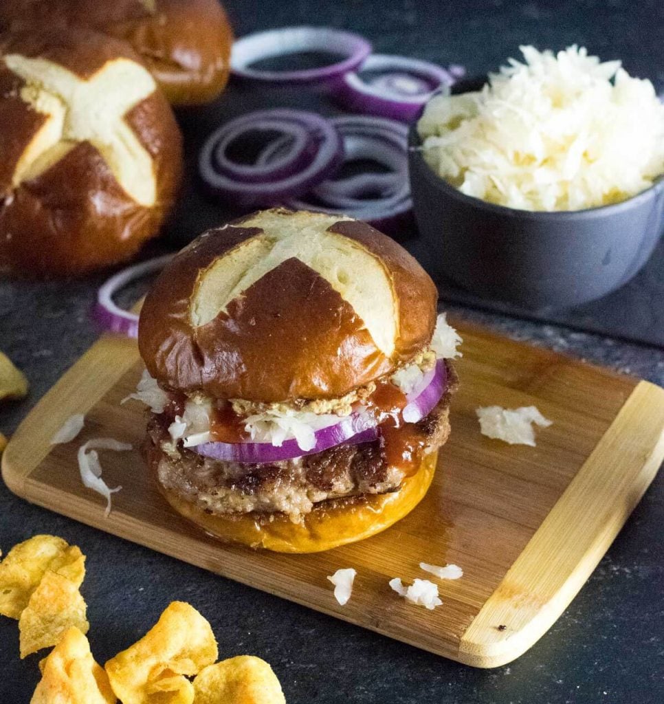 Homemade brat burger on pretzel bun