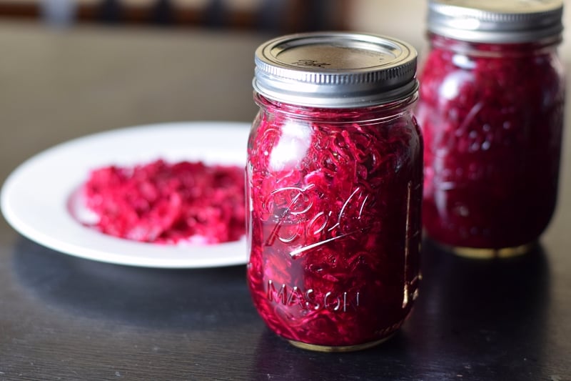 Homemade fermented sauerkraut in two pint jars.