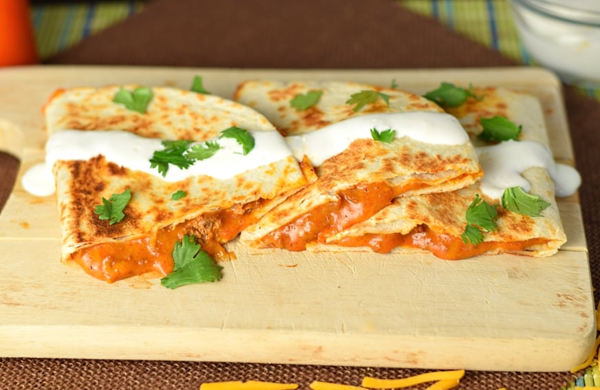 Chili Quesadilla sliced on cutting board.