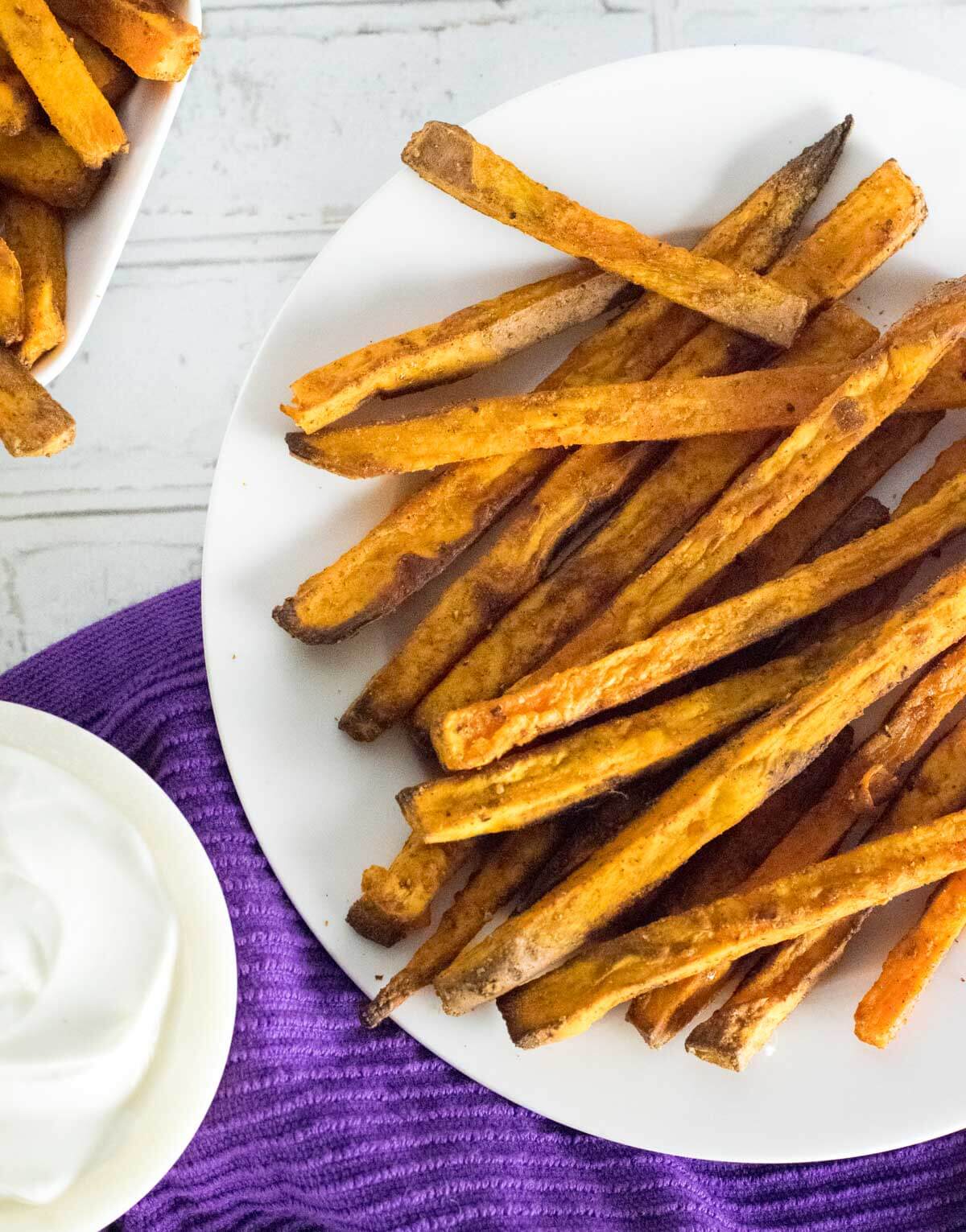 Sweet potato fries on plate with dipping sauce