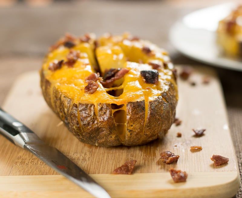 Blooming potato on cutting board.