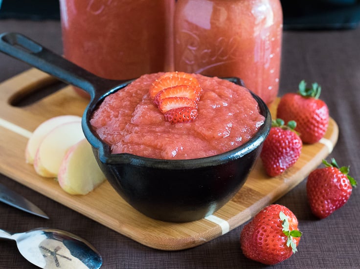 Homemade Strawberry Applesauce with apple slices and fresh strawberries.