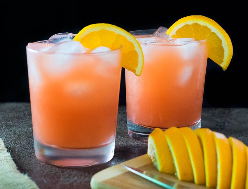 Two glasses of cranberry orange juice.
