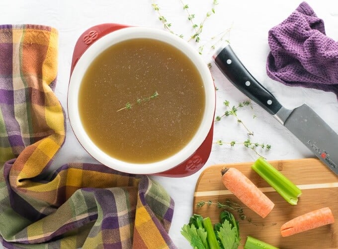 Homemade beef stock with carrots and celery.