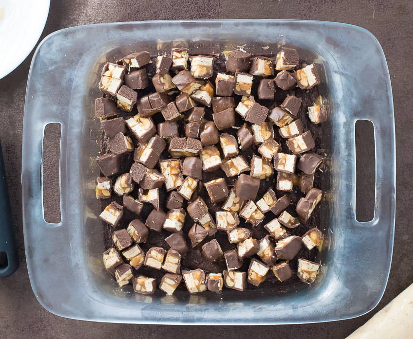Making snickers brownies.