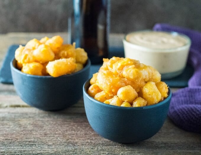 Two bowls of Wisconsin Beer Battered Deep Fried Cheese Curds with dip.