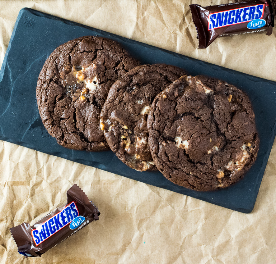 Three Triple Chocolate Snickers Cookies shown from above.