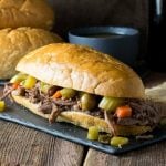 Crock Pot Italian Beef Sandwich Chicago Style on dark platter