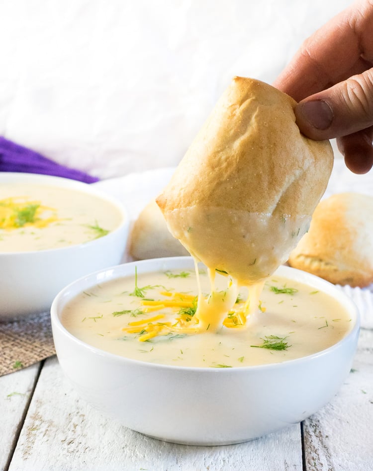 Potato dill soup and dinner roll.