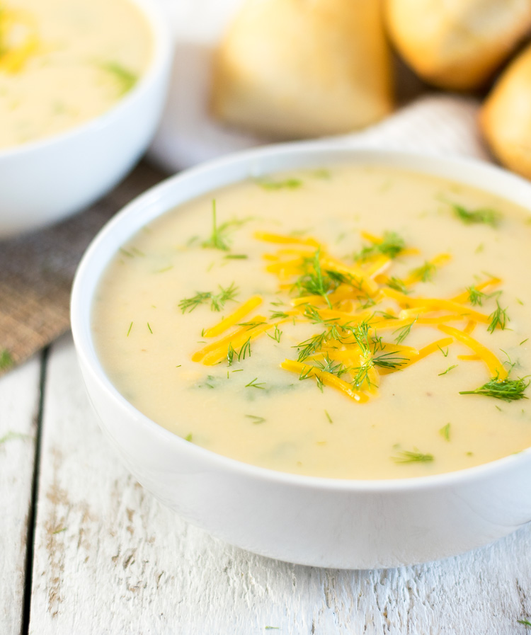 Potato soup with dill and melted cheese.