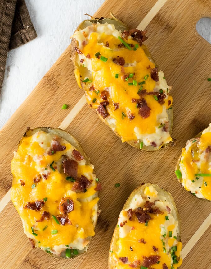 Twice Baked Potatoes on cutting board.