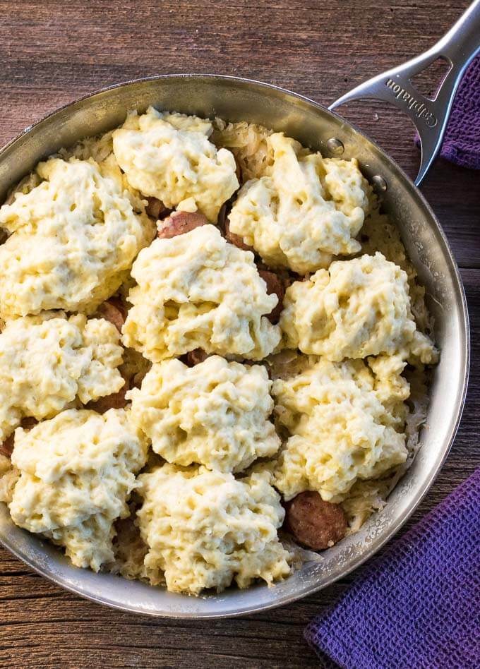 Above view of dumplings resting on a bed of sauerkraut