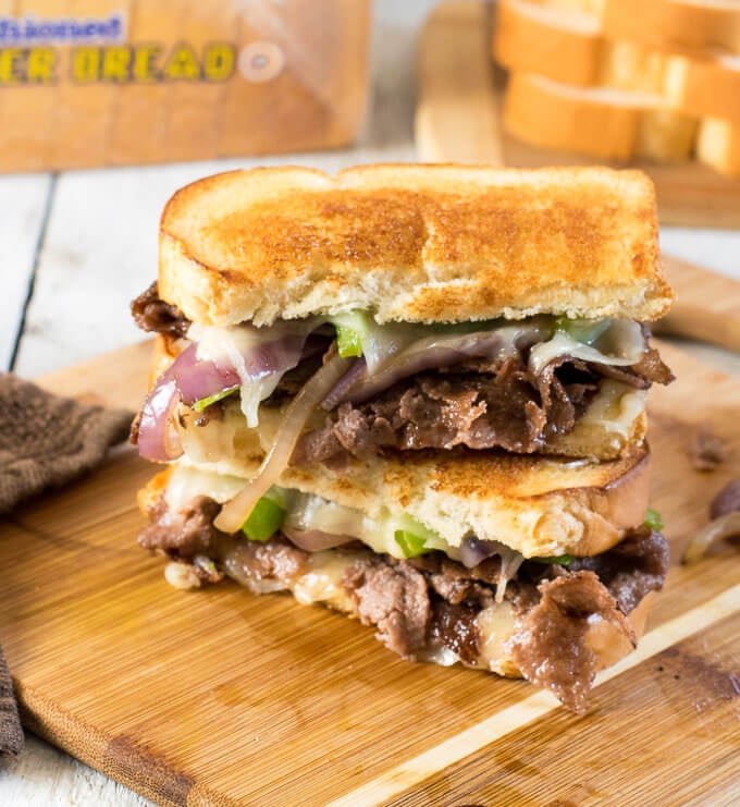 Stacked Philly Cheesesteak Grilled Cheese on cutting board