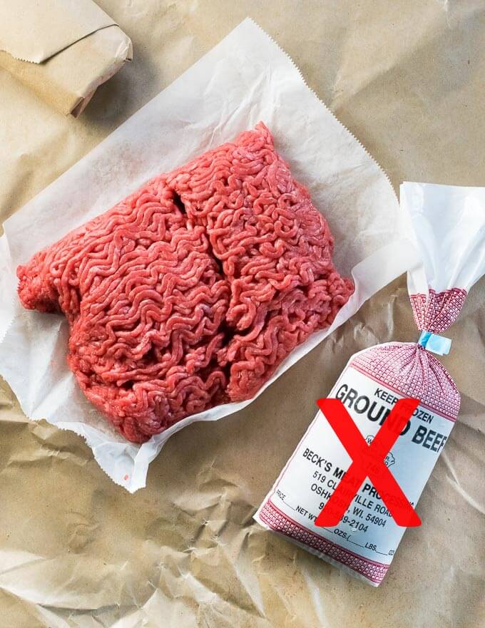 Fresh ground hamburger for making burgers with frozen package also shown.