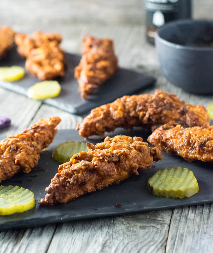 Nashville Hot Chicken Fingers on plate with pickles