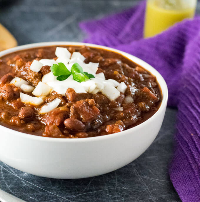 Serving deer meat chili in a bowl.