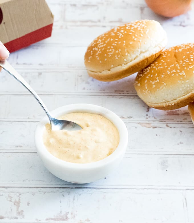 Making homemade big mac sauce in a small bowl.