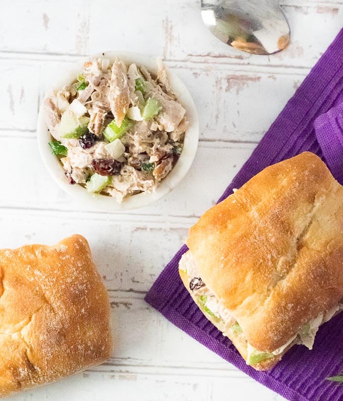 Serving chicken salad with apples and bread.