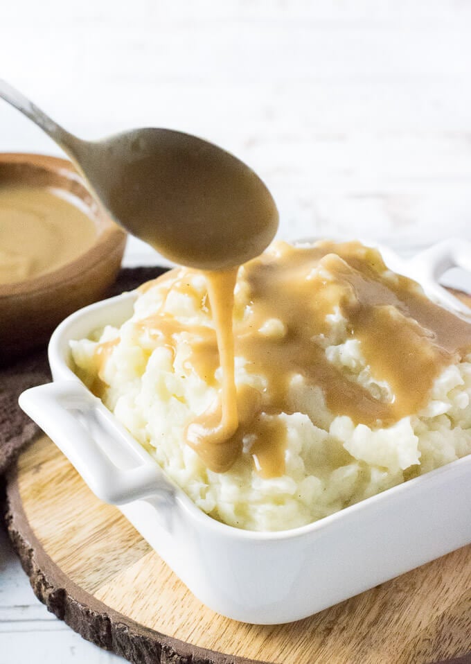 Brown gravy over mashed potatoes.