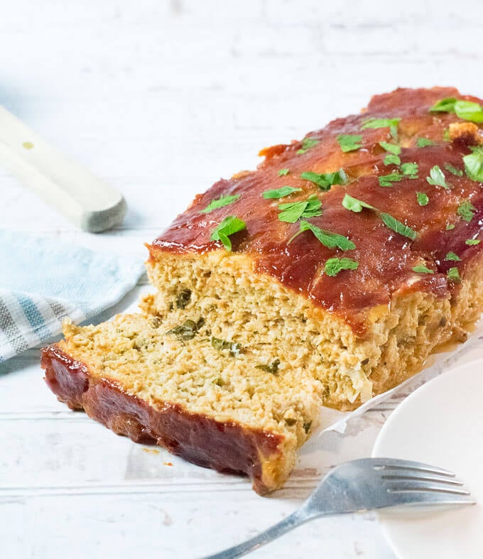 Sliced Chicken meatloaf on table.