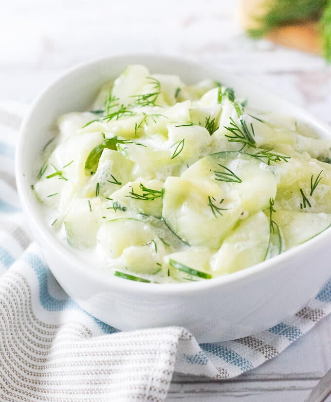 German Cucumber Salad sitting on a kitchen towel.