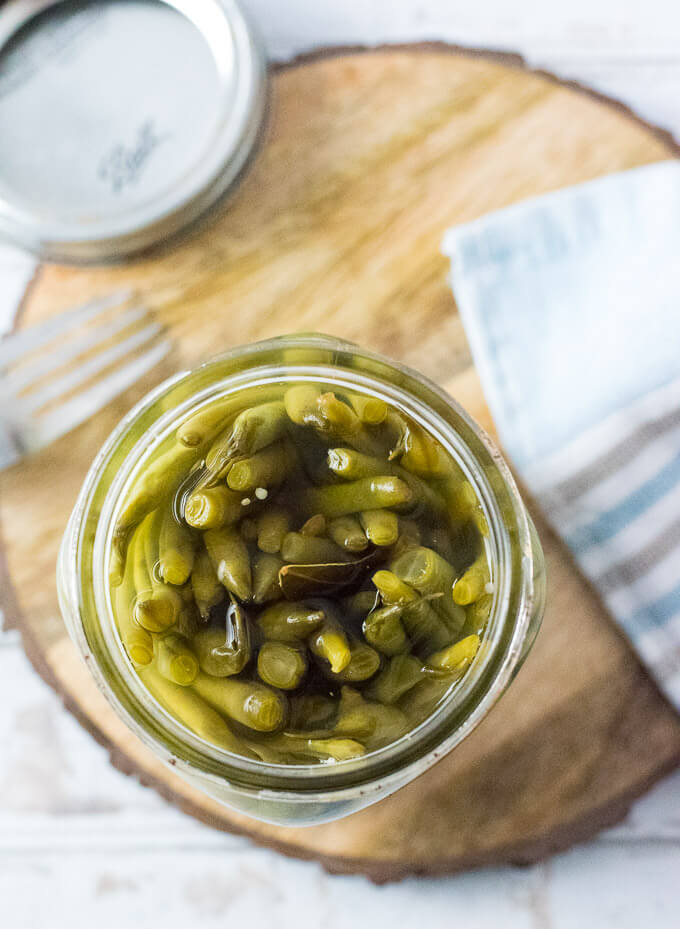 Pickled Green Beans packed into jar.