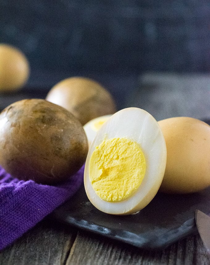 Smoked egg cut in half to show yolk.