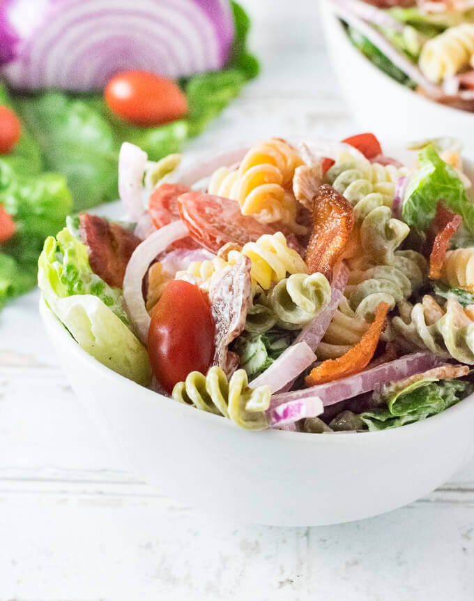 BLT Pasta Salad in a white bowl shown close up.