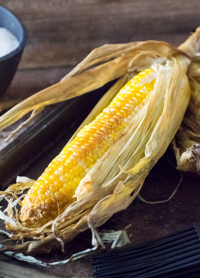 Smoking sweet corn in husk.