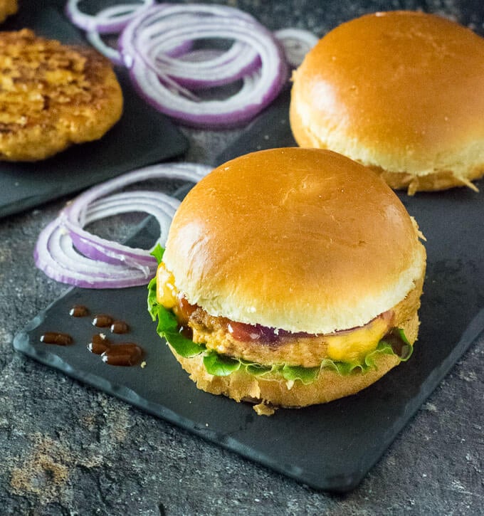 Serving Chicken Burger with barbecue sauce.