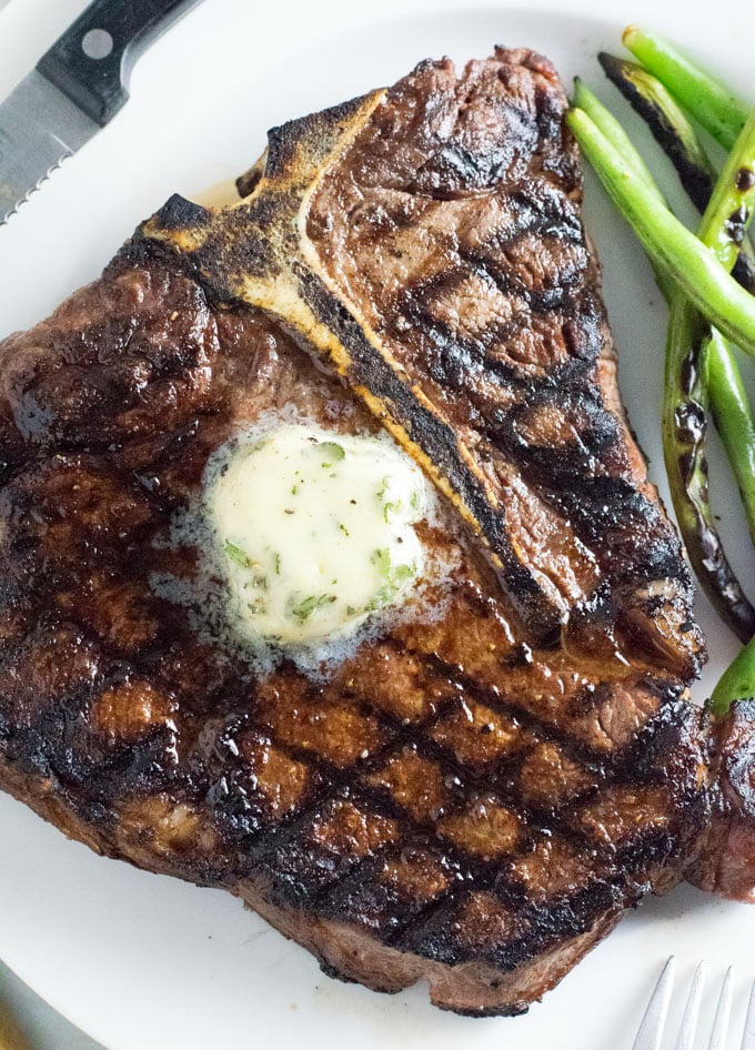 Steak Butter melting over T-bone steak.