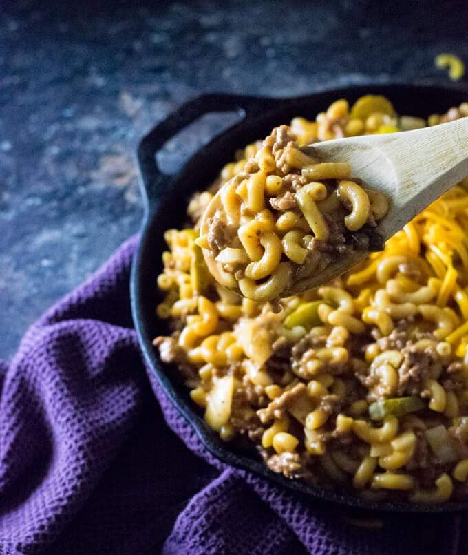 Serving cheeseburger macaroni.