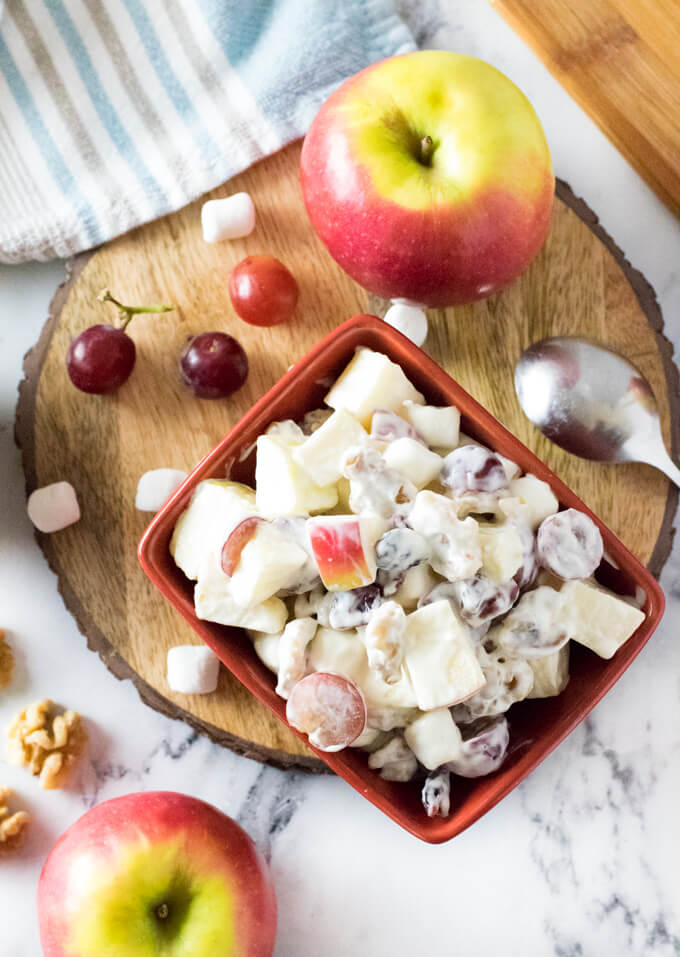 Apple salad with mayo and grapes.