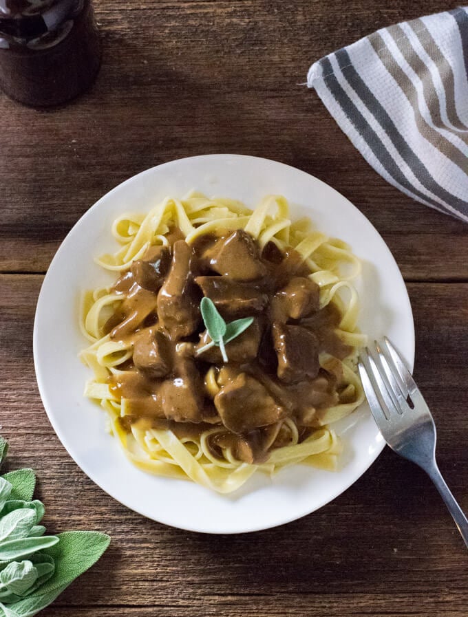 Old fashioned beef and noodles served on table.