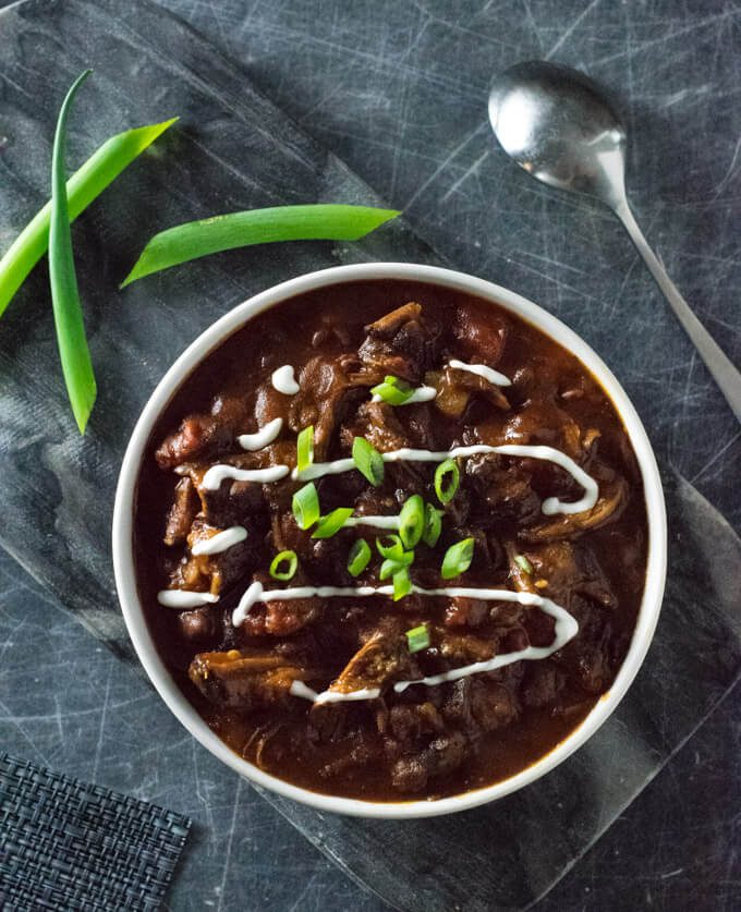 Smoked chili in a white bowl.