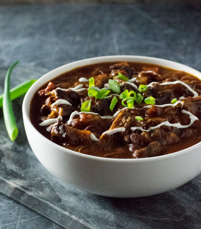 Smoked chili with sour cream and green onion.