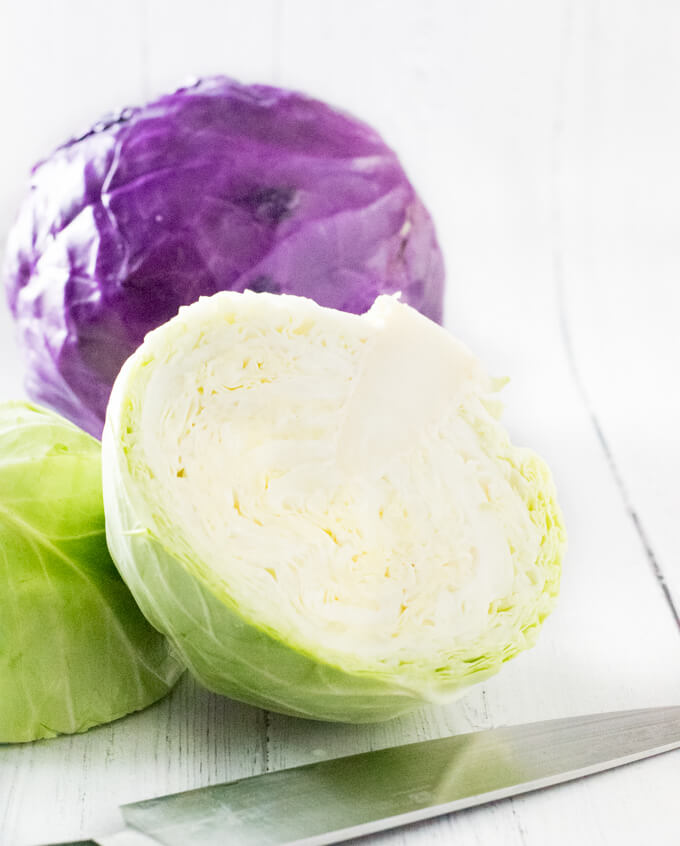 Cut cabbage in half.
