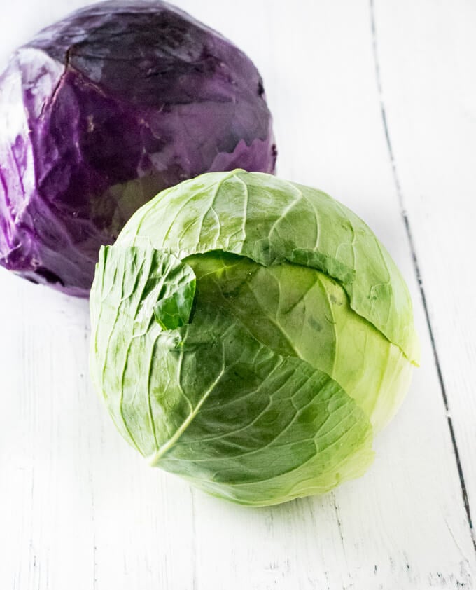 Whole cabbage with loose leaves.