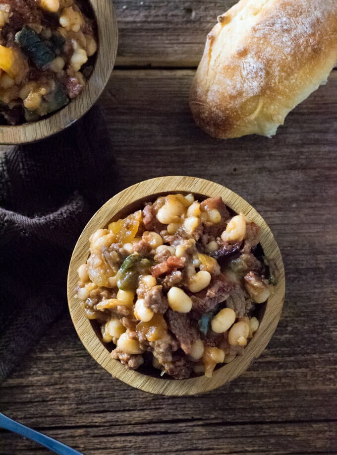 Serving Cowboy baked Beans on table.