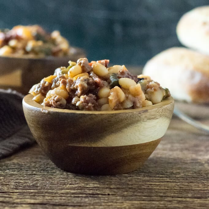 Cowboy baked Beans in wooden bowl.
