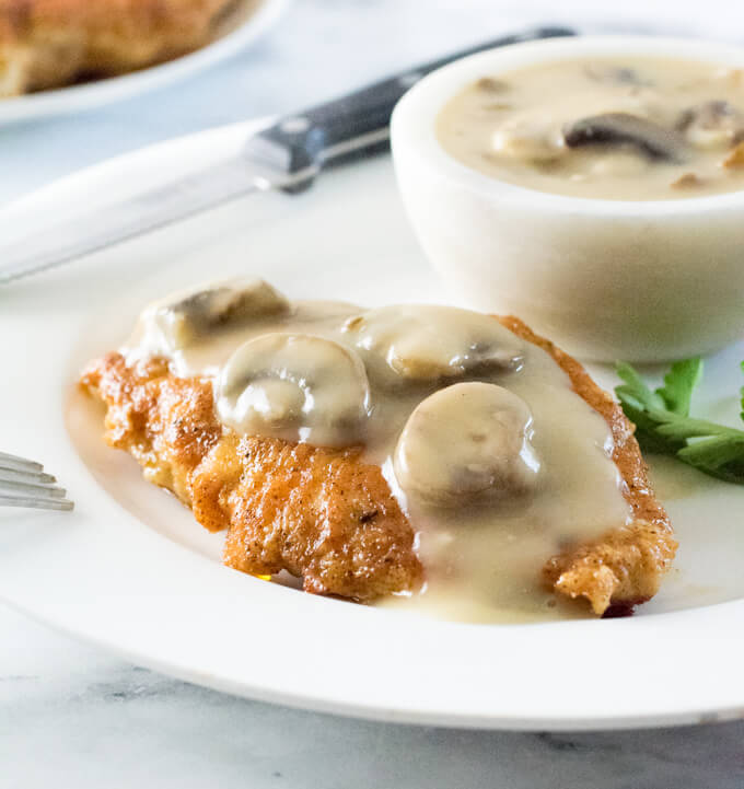 Cooked lightly breaded chicken breast smothered with mushroom gravy.