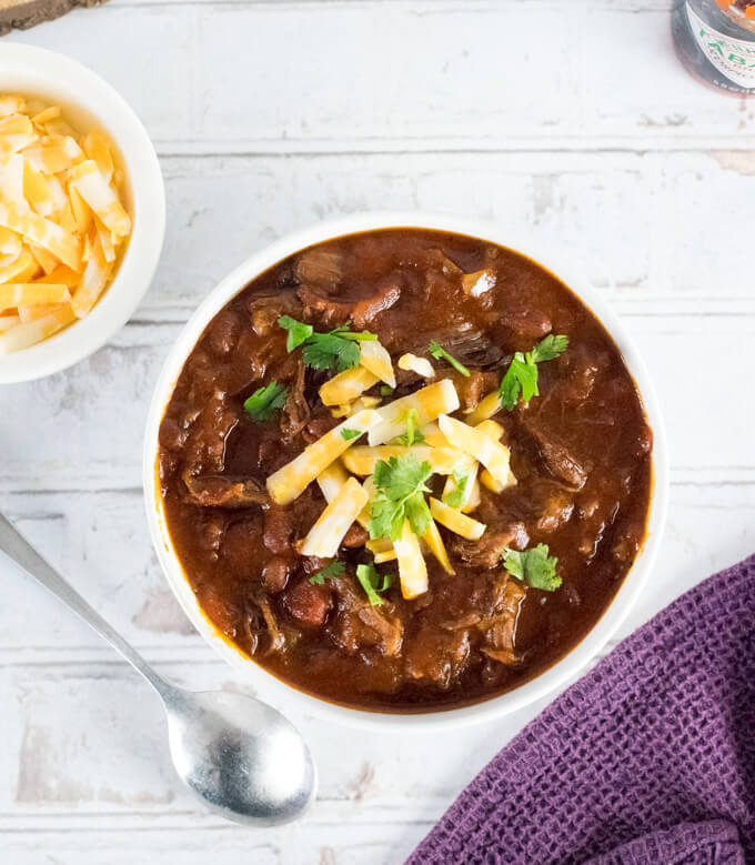 Shredded Beef Chili in white bowl viewed from above.